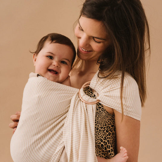 Tutoriels Studio Romeo, guide pratique pour un portage bébé confortable et sécurisé.